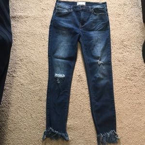 Free People skinny jeans with frayed ankles